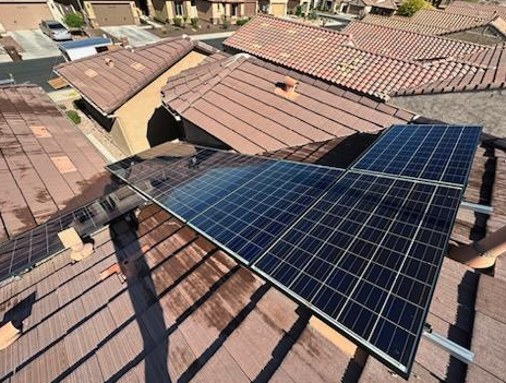 Solar sun-screen mesh cleaned on an Arizona tile-roof home