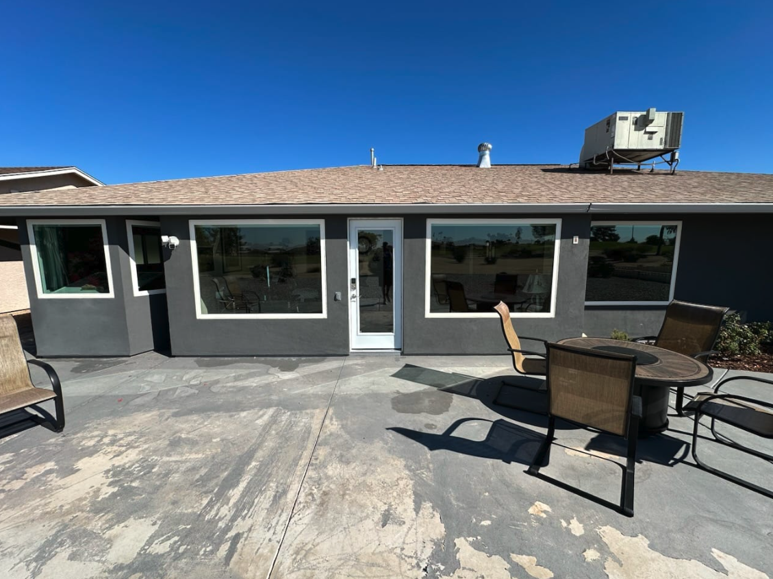 Backyard window screens washed on a single-story Arizona home