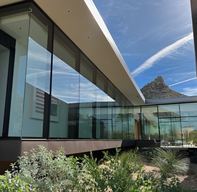 Modern desert home with freshly cleaned floor-to-ceiling window screens
